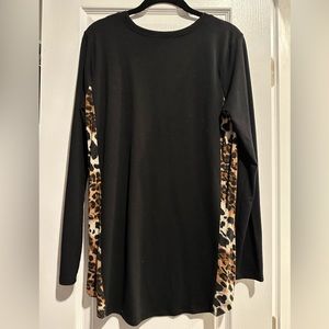 Women’s long sleeve black shirt with leopard detail on sides. Size M